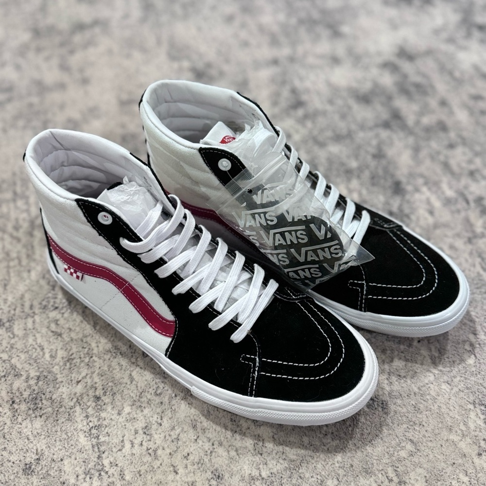 Vans black and white checkerboard with red design. New without box.
